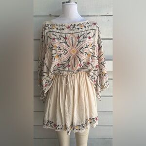 Free People cream embroidered mini dress.